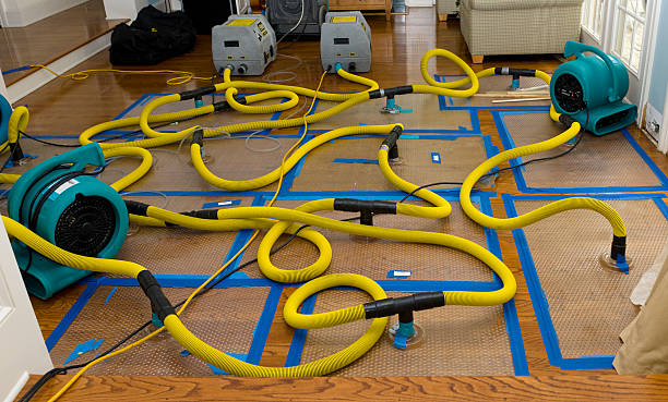 Professional Flood Damage Restoration technician working in Rome, GA